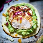 Grain-Free Chicken Tostadas on guacamole with cheese