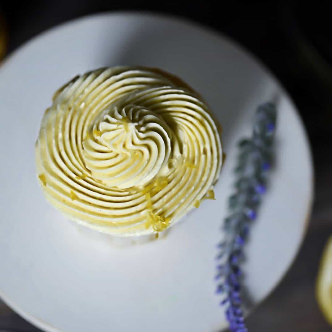 low carb lemon cupcake above shot frosting
