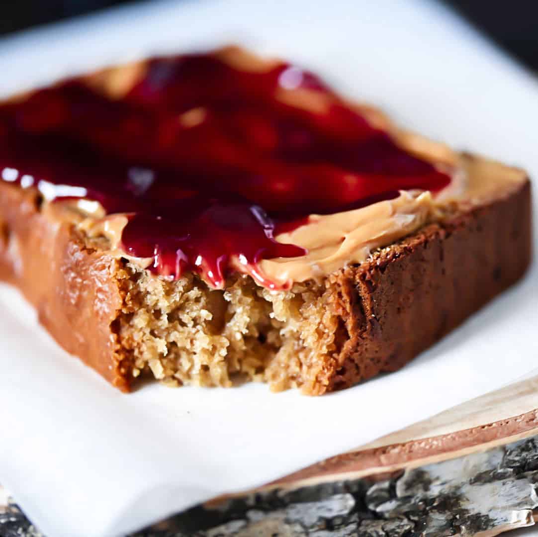 Closeup Peanut Butter Bread with jam on wooden board